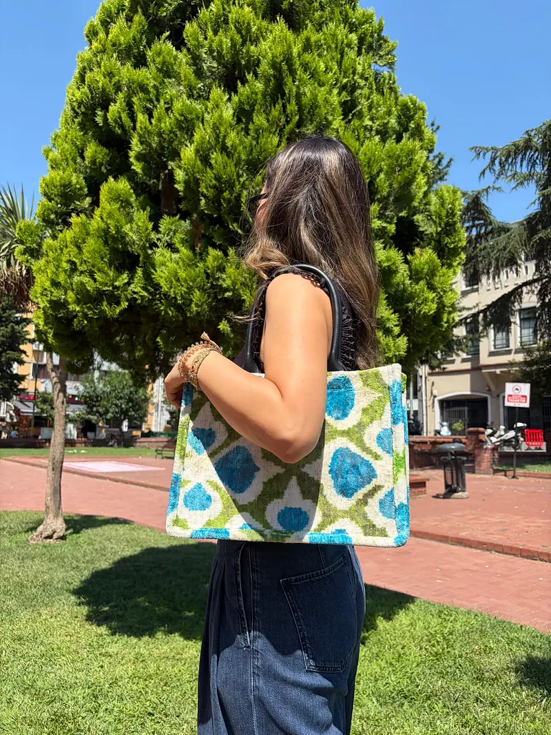 The same tote worn over the shoulder, seen from behind