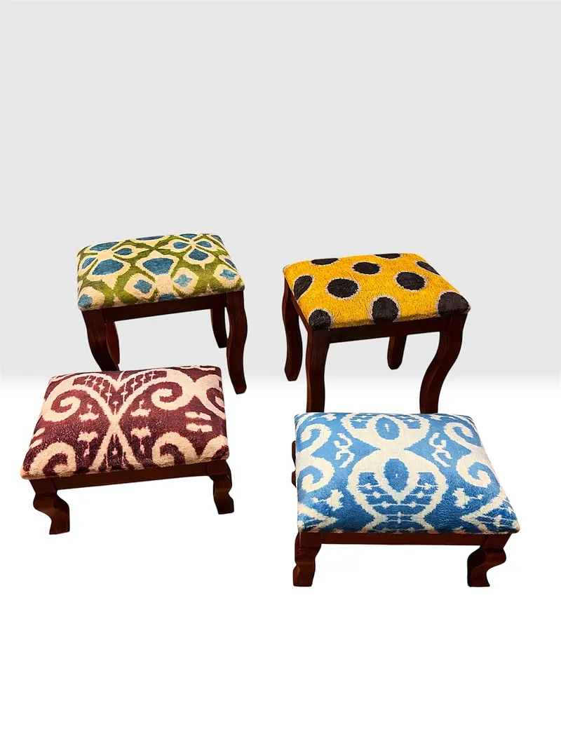 The same four stools in a looser arrangement