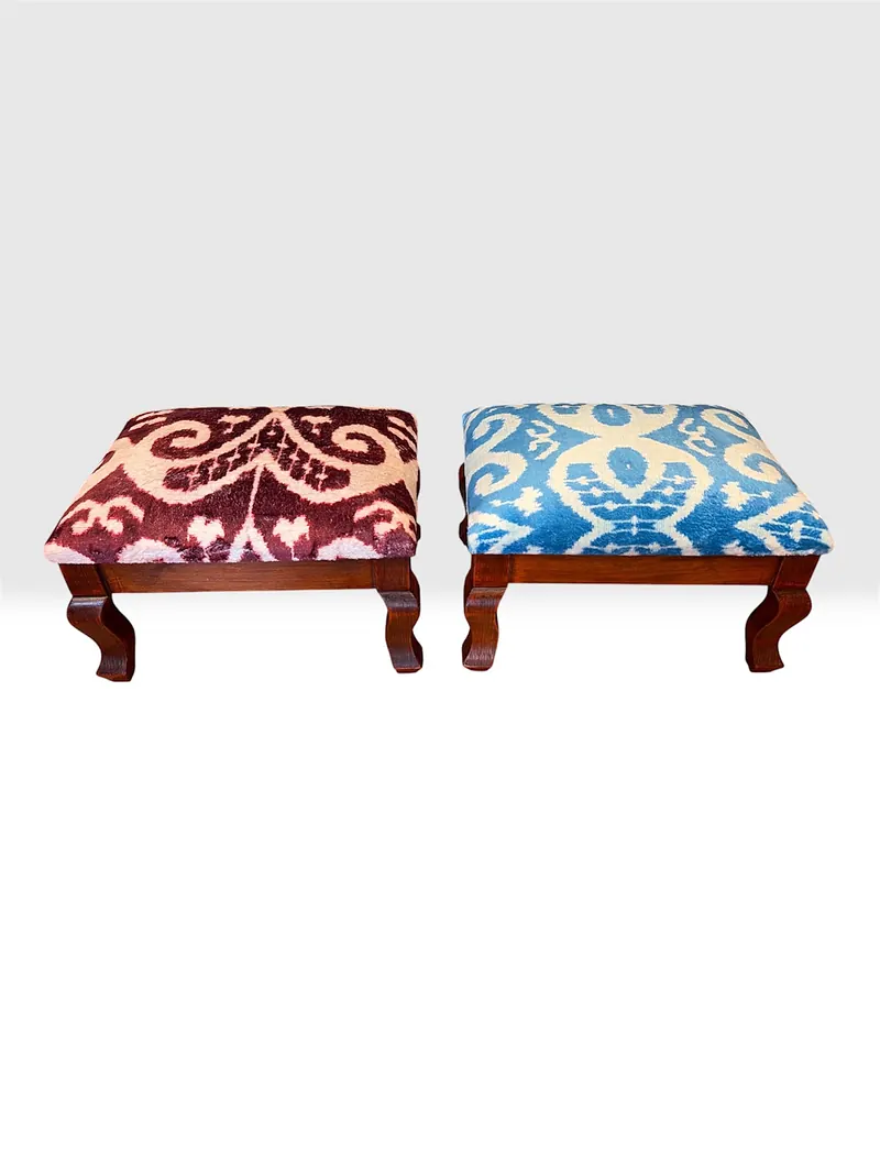The burgundy and blue stools side by side