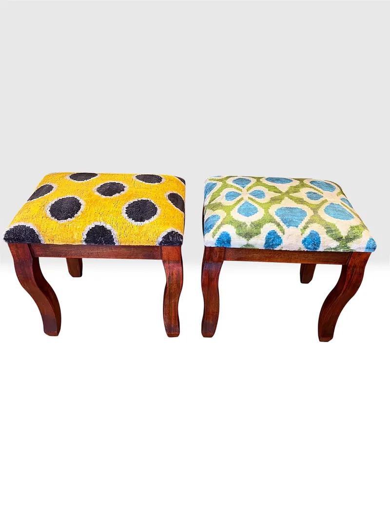 The saffron and garden-lattice stools side by side